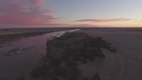 Drone Flying Backwards From River Raw Stock Footage 78873200