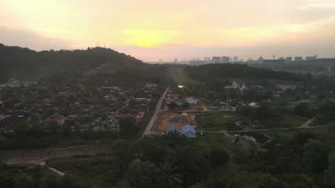 Drone flying backwards with sunset view in Kajang Stock Footage 150748667