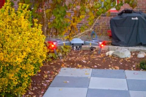 Drone flying in a backyard Stock Photos