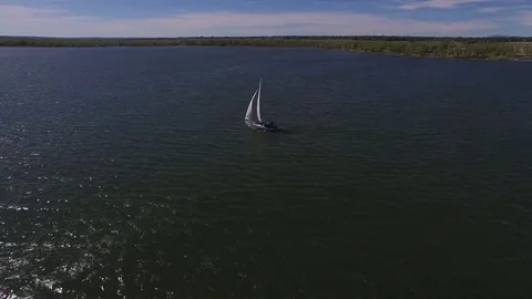 Drone flying behind a sailboat Stock Footage 77333491