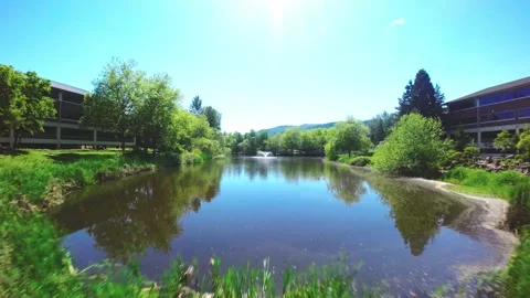 Drone Flying Between Costco Buildings then Flying Over A Fountain Stock Footage 242629455