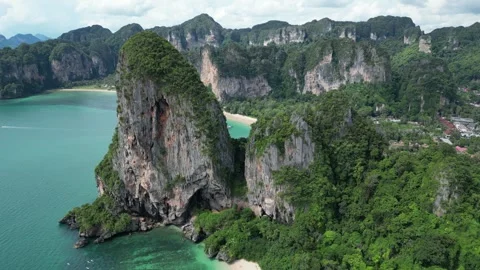 Drone Flying Between Limestone Cliffs at Railay Beach in Krabi, Ao Nang, Stock Footage 334726020