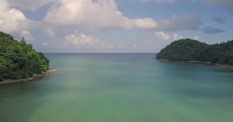 Drone Flying Between Small Islands Out To The Ocean Areal View 4K Real Time Stock Footage 104572454