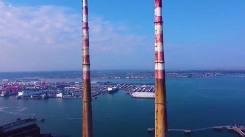 Drone flying between two chimneys of Poolbeg landmark Stock Footage 272607532