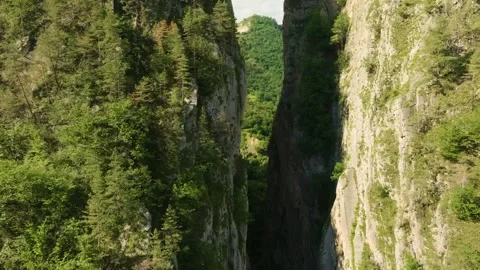 Drone flying between two massive, closely spaced mountains in Karadakh Gorge, Da Stock Footage 303416168
