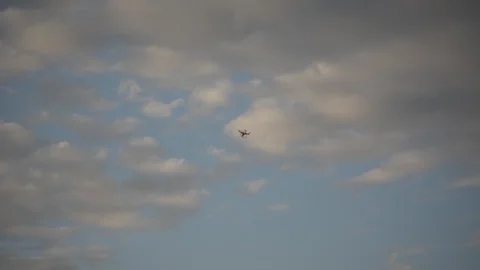 Drone flying in the blue sky with a clouds. Quadcopter drone flaying in the sky  스톡 동영상 99114718