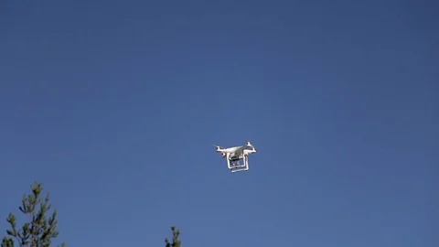 Drone flying in blue sky Stock Footage 86510933
