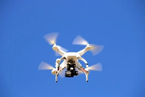 Drone flying in the blue sky 스톡 사진