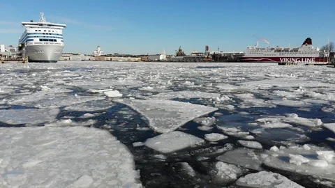 Drone flying close to broken ice on sunny weather at Helsinki Stock Footage