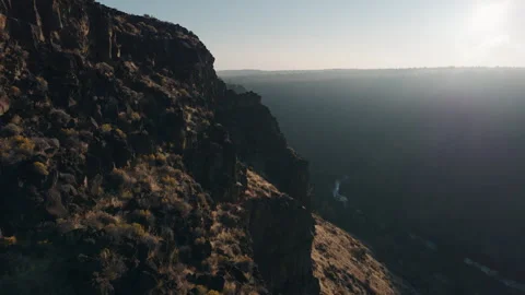 Drone Flying Close to a Cliffside During Sunrise. Stock Footage 251617625