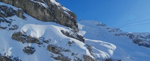Drone flying close to mountain while ski lift is going up. Aerial view Stock Footage 121477341