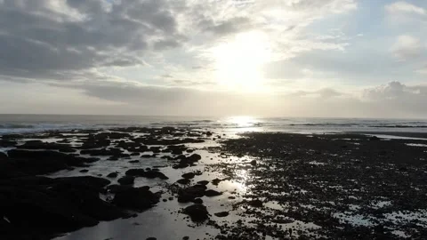Drone flying close to the ocean rocks sea shore Stock Footage 303639026