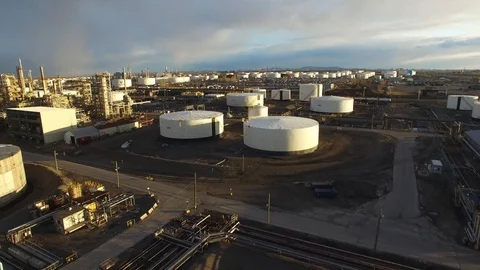 Drone flying close over oil drums within Suncor major oil refinery Stock Footage 88418896