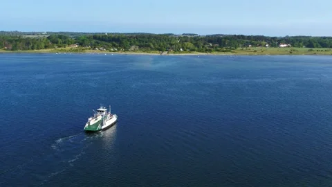 Drone flying close to small local ferry over small strait 4K Video stock 236723315