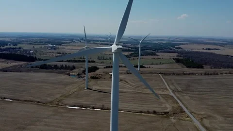 Drone flying close towards windmills in countryside on sunny day 스톡 동영상 280010728