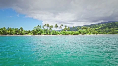 Drone flying close to water approaching tropical island. Video stock 167430138