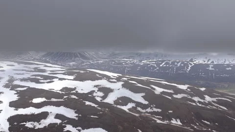 Drone flying up to the cloud ceiling and returning, Spring in Iceland Stockbeeldmateriaal 335815056
