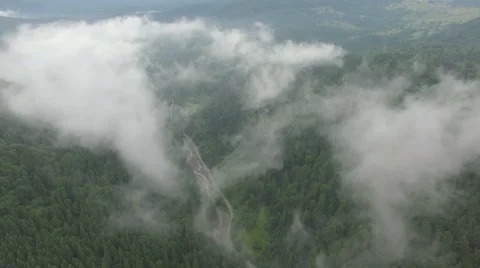 Drone flying in the clouds above the mountains Stock Footage 67203637