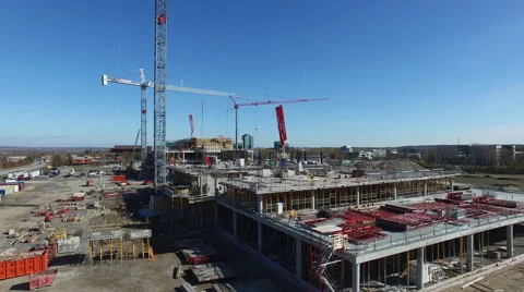 Drone flying by construction cranes 2 Video stock 64126378