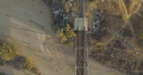 Drone flying directly overhead of a walking biking trail Stock Footage 100048335