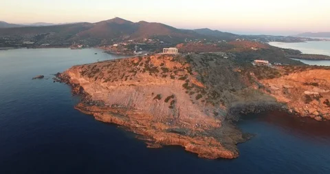 Drone flying from distance to the temple of Poseidon during the sunset in Athens Stock Footage 85583071