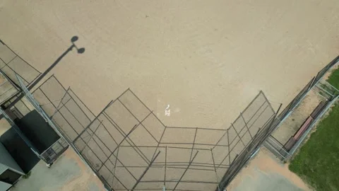 Drone flying down and back from softball diamond Video stock 246566622