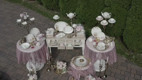 Drone flying down closely toward decorative tea table installation Video stock 330202560