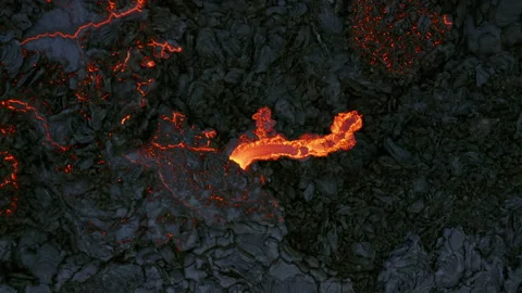 Drone flying down to flowing lava, Volcano Eruption in Iceland Aerial Video stock 153699693