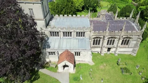 Drone flying down in front of St Mary's Church North Marston Stock Footage 242600416