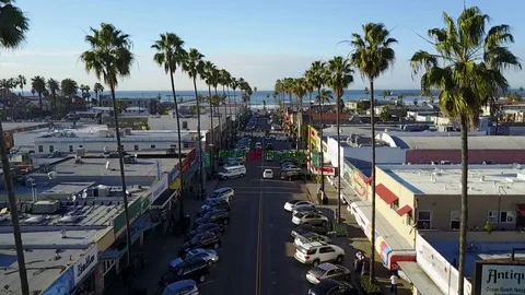 Drone flying down main beach street Stock Footage 71135555