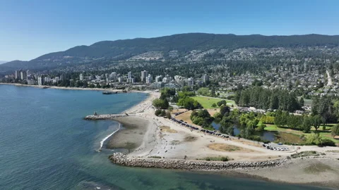 Drone Flying Down Toward Ambleside Beach in West Vancouver, British Columbi.. Stock Footage 329818636