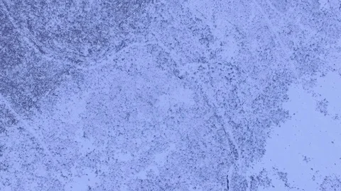 Drone flying down view of snow patterns on the ground, part 2 Stock Footage 82902771