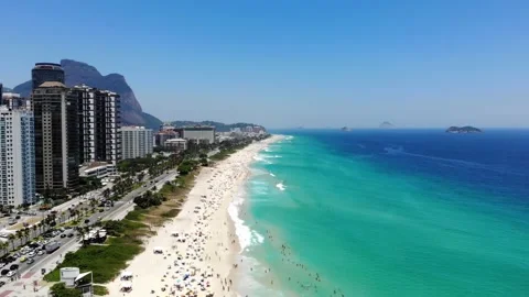 Drone flying downwards in Barra da Tijuca beach . beach on beautiful sunny day Stock Footage 149559337