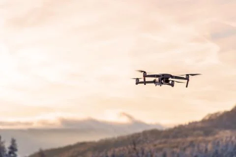 Drone flying at dusk. Stock Photos