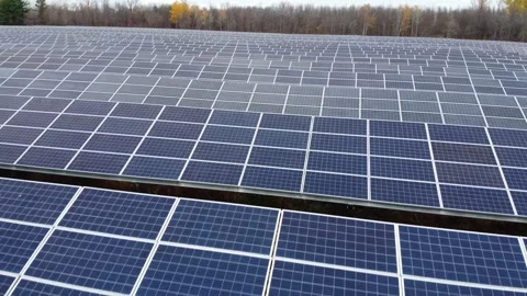 Drone flying fast and low over solar panels on sunny day 스톡 동영상 280009860