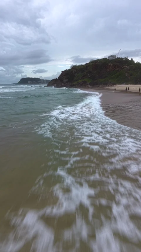 Drone flying fast over crashing waves and a beach Stock Footage 330976809