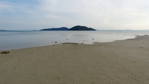 Drone flying fast pass the sea to the island 库存影片 145647671
