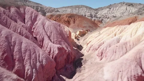 Drone flying fast trough Tierra de Colores, a geological formation in Patagonia Stock Footage 249565870