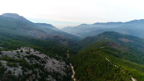 Drone flying up. Footage view at Taurus Mountains with green thick forests and Stock Footage 86535335