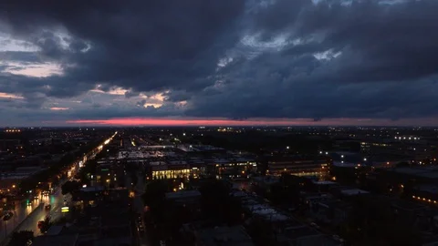 Drone flying forward after sunset on cloudy stormy day with pink sky away Video stock 114715899