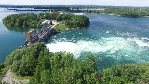 Drone flying forward and over large swirl in water made from hydroelectric dam Stock Footage 92866901