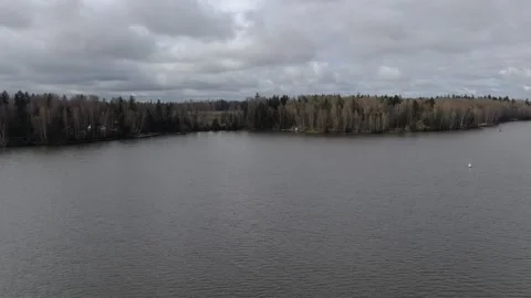 Drone flying forward and rising above river Stock Footage 329742401