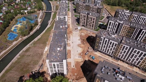 Drone flying forward and tilting up over residential complex Stock Footage 329743175