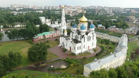 Drone flying forward with downward rotation above monastery Video stock 324756318