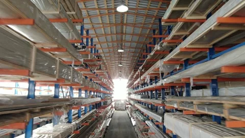 Drone flying forward inside aluminum warehouse Stock Footage 325777891