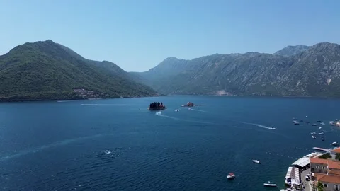 Drone Flying Forward to Islands with Mountain Views in Perast – 4K Aerial Stock Footage 313900670