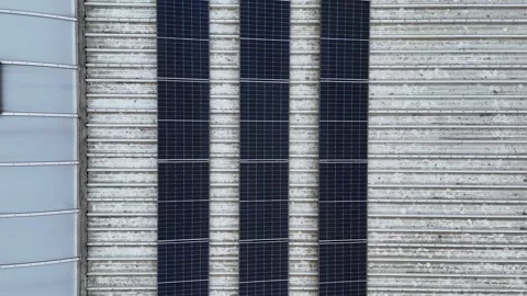 Drone Flying Forward Over Corrugated Industrial Roof With Solar Panels Stock-Footage 330750105