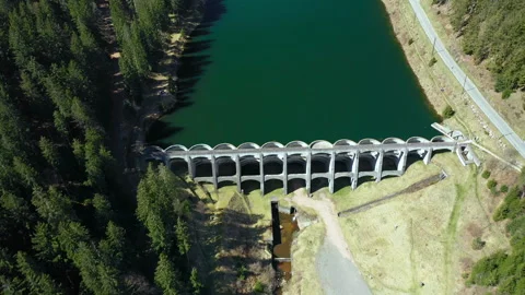 Drone flying forward over dam and forest, aerial top view landscape Stock-Footage 333073114