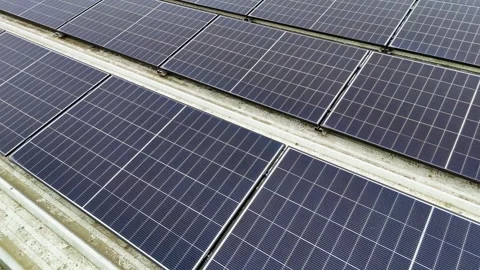 Drone Flying Forward Over Dark Solar Panels On Corrugated Metal Flat Roof Stock Footage 330750416