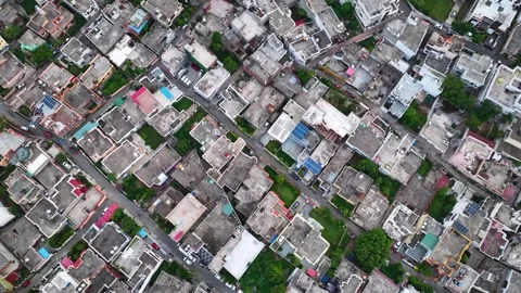 Drone flying forward over highly congested urban architecture and rooftops .. Stock Footage 339546789